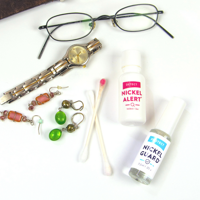 Nickel Alert and Nickel Guard shown with items to test. Earrings, glasses, watches, etc.