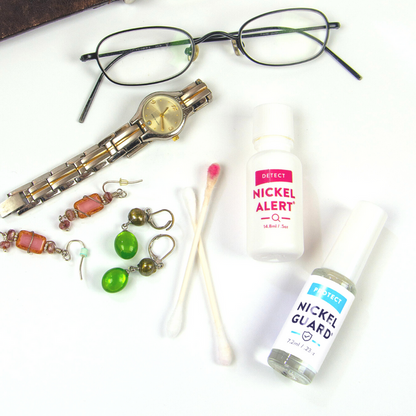 Nickel Alert and Nickel Guard shown with items to test. Earrings, glasses, watches, etc.