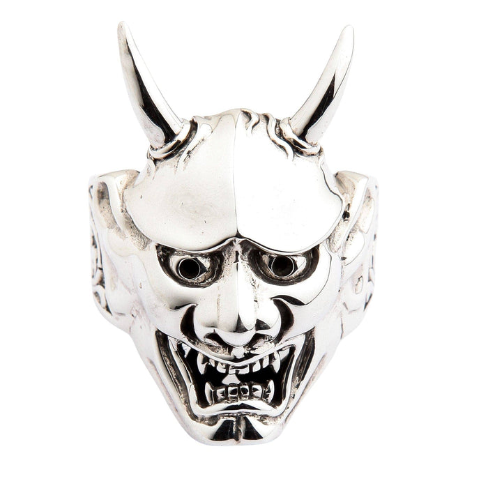 A polished solid silver Oni mask ring with sharp horns, isolated on a white background.