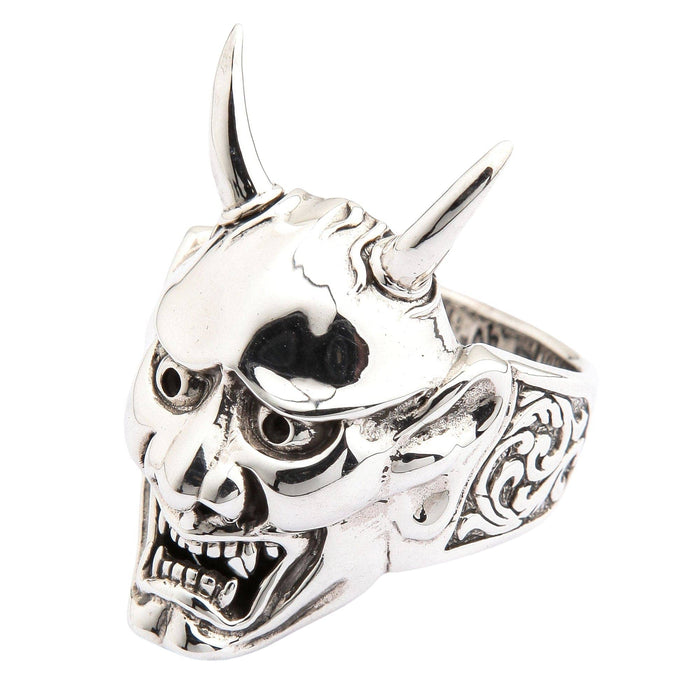 A side view of the samurai mask style ring on a white background, detailing the intricate carvings.