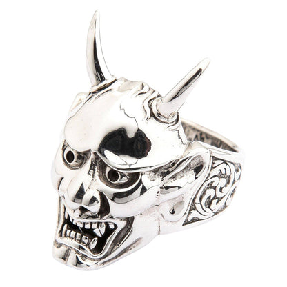 A side view of the samurai mask style ring on a white background, detailing the intricate carvings.