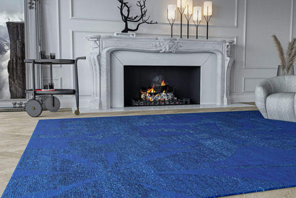 Lifestyle shot of Paradise Killer Blue, a hand knotted rug designed by Tufenkian Artisan Carpets. room-imageLifestyle room-image
