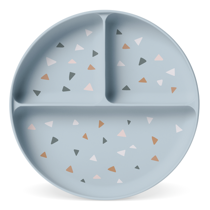Soft blue-gray decorative plate with small triangle shapes in pale pink, terracotta, charcoal gray, and cream accents
