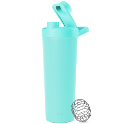 Soft pale turquoise container with stainless steel silver-gray mixing ball on white background
