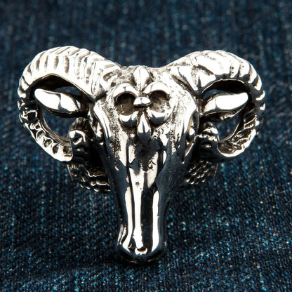 Close-up resting on blue denim, emphasizing the polished snout and intricate crown emblem of the men's silver piece.