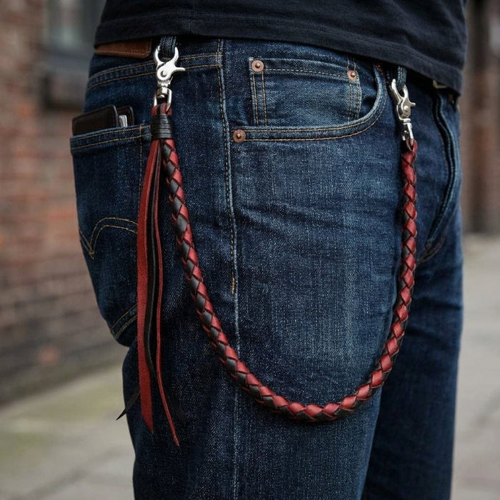 Red black braided leather wallet chain attached to jeans with silver clasps