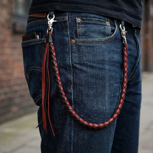 Red black braided leather wallet chain attached to jeans with silver clasps