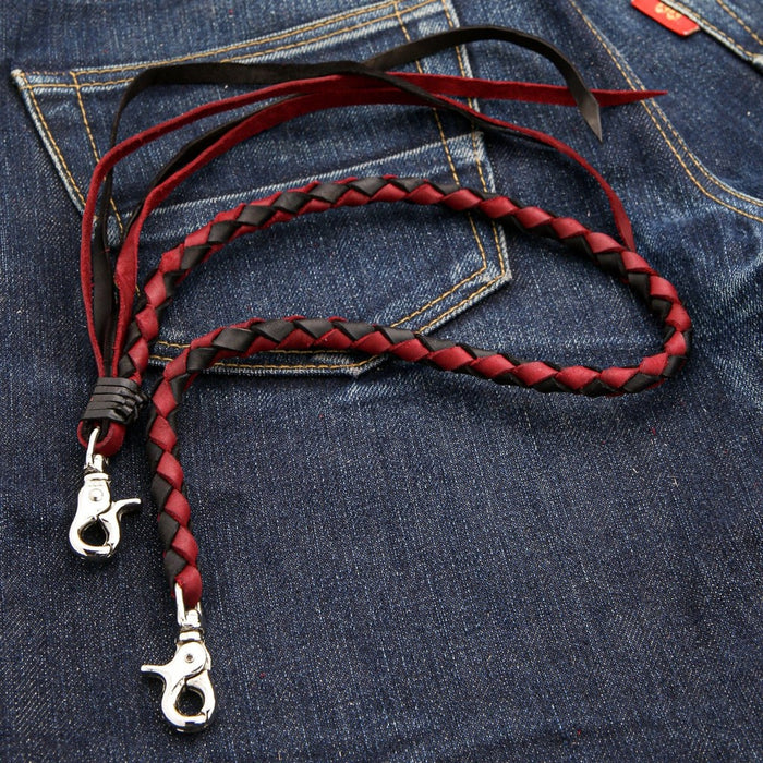 Close-up of handcrafted red black braided leather wallet chain pattern