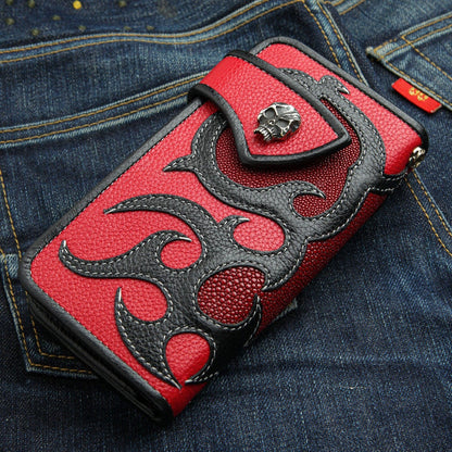 A red and black trucker wallet with a tribal flame inlay made from genuine stingray skin.