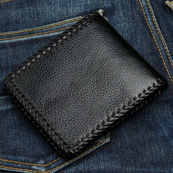 Angled rear view showing the compact thickness and texture of the leather