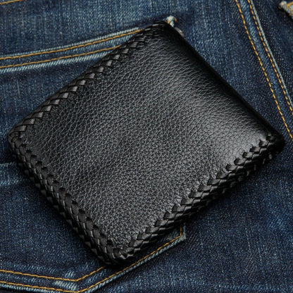 Angled rear view showing the compact thickness and texture of the leather