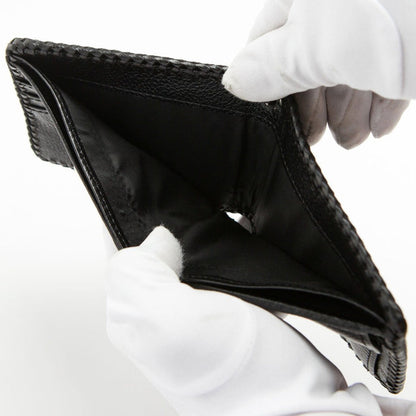 Open wallet displaying the spacious bill compartment and textile lining