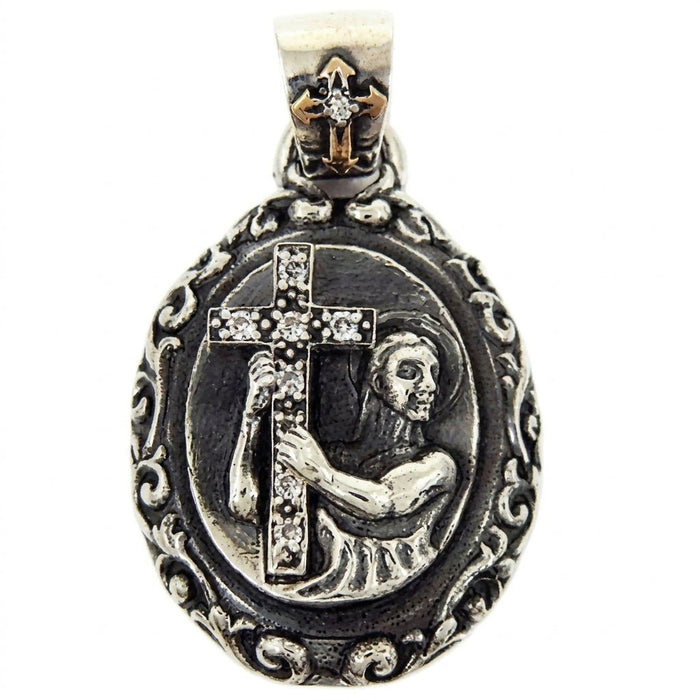 Front view of the Saint & Cross Medallion Pendant featuring a figure holding a CZ-lined cross against oxidized sterling silver