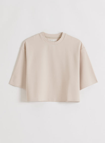 A sand-colored aim'n Luxe Boxy Short Sleeve top, laid flat [M-170CM]