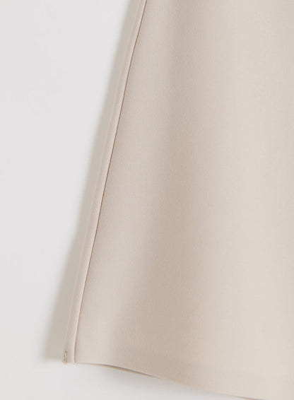 Close-up of the smooth sand modal-blend fabric on the aim'n Luxe Mini Skort.