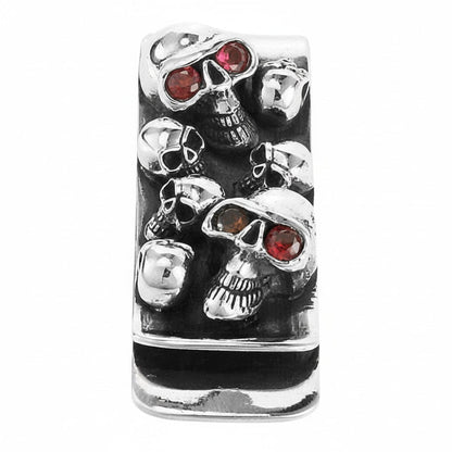A front view of the gothic skull money clip, showing the skull pile and red garnet eyes.