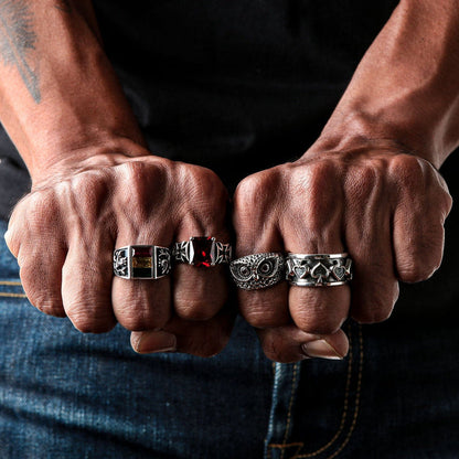 A man's hand wearing the heavy sterling silver gambler's spinner ring.
