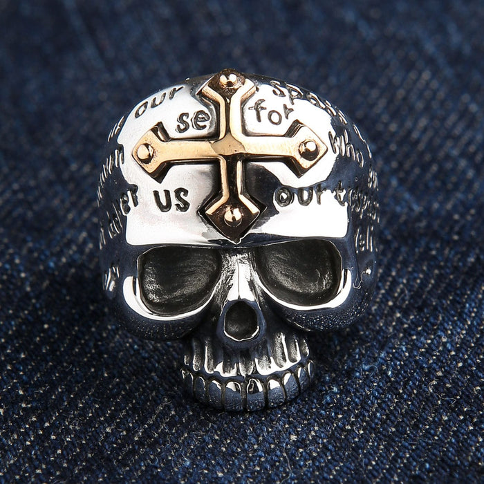 A front view of the sterling silver cross skull ring, showing the gold cross and engraved Lord's Prayer.