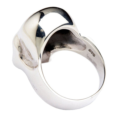 The inside of the heavy silver skull ring, showing the .925 hallmark and comfortable band.