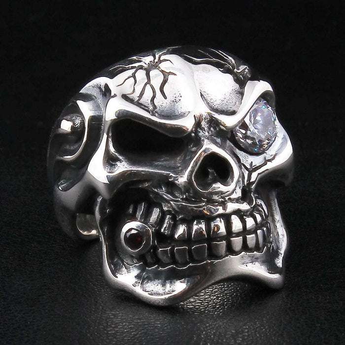 A men's solid sterling silver ring in the shape of a cracked mafia skull with a large clear diamond CZ eye.