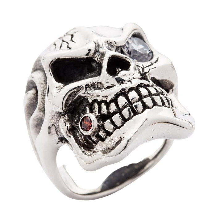 A piece of gangster-style jewelry, this skull ring has a single diamond eye and cracked forehead.