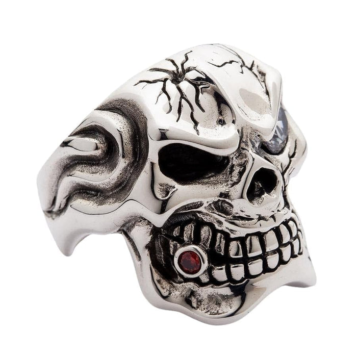 A side view of the cracked skull ring, showing the brilliant diamond eye and red garnet tooth.