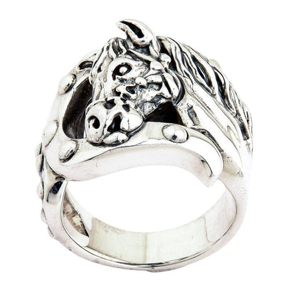 Tilted perspective showing the solid silver horse face overlapping the lower horseshoe frame, revealing the smooth inner band.