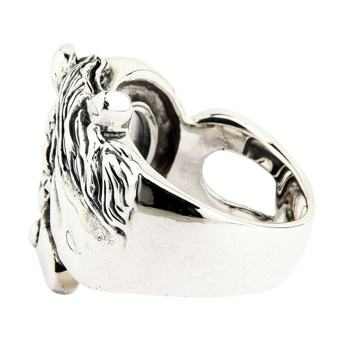 Rear view displaying the smooth polished inner band and hollowed back of the solid silver equestrian ring face.