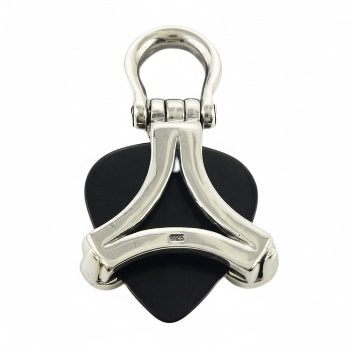 The back of the silver pick holder pendant showing the "rasta vibrations" engraving.