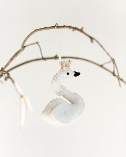 felt white princess swan with pearl necklace and gold crown hanging on a branch