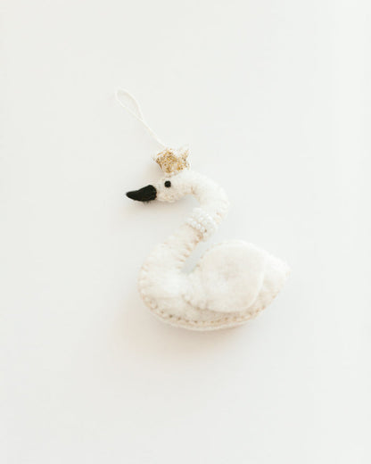 felt white princess swan with pearl necklace and gold crown hanging on a branch