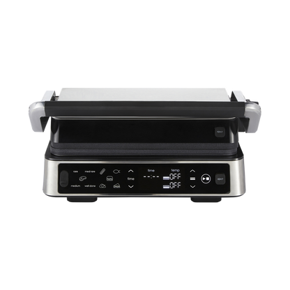 Black and silver grill with digital controls on a white background