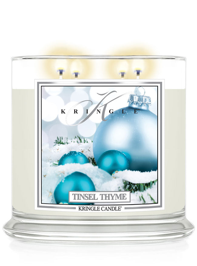 Kringle Candle Tinsel Thyme candle with blue ornaments on a white background