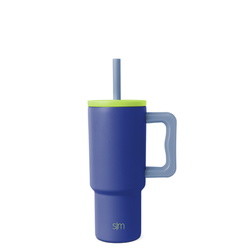 Navy blue tumbler with vibrant lime green lid, rim band, and handle for secure grip and easy carrying.