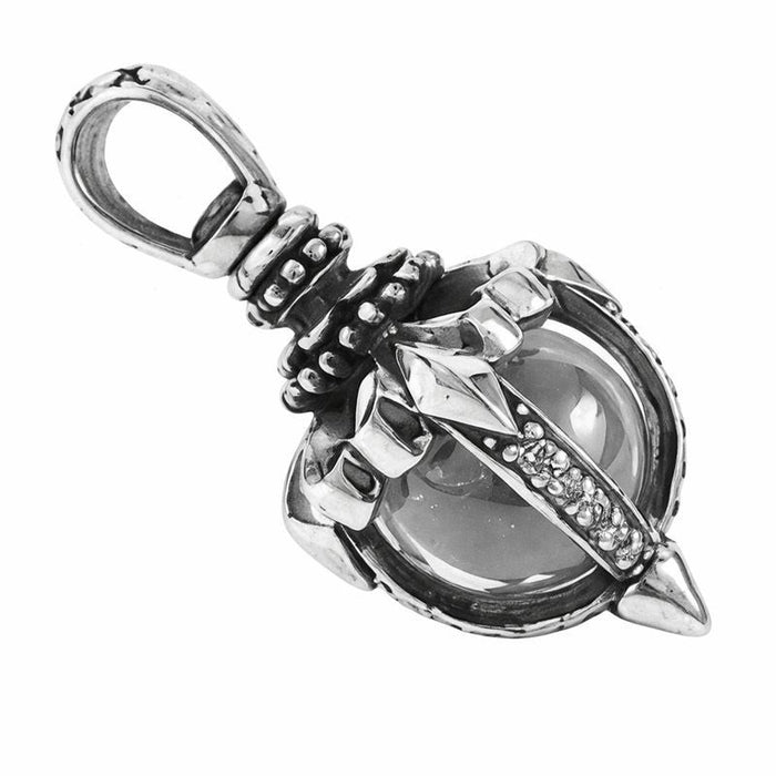 Angled view of gothic sterling silver pendant highlighting CZ accents and tribal design