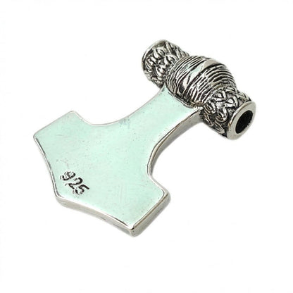 Polished back of the sterling silver hammer pendant displaying a clear 925 hallmark stamp on the lower left.