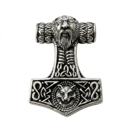 Direct view of the silver Mjolnir pendant emphasizing the sculpted bearded face top and central triquetra knotwork.