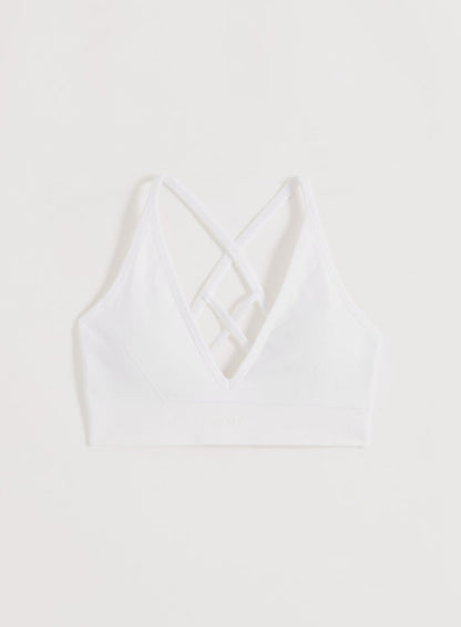 White aim'n Shape Seamless Cross Back Bra with cross-back straps and a ribbed underband.