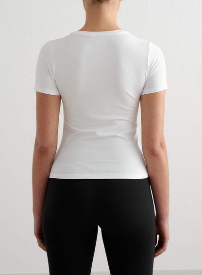 Tight-fitting white short-sleeve top from aim'n with a soft feel, featuring a small logo on the back neckline.