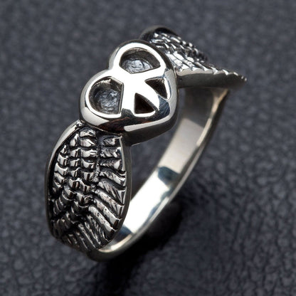 A gothic and hippie style ring symbolizing peace, love, and freedom with detailed angel wings.