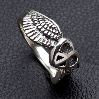 A side profile of the angel wing ring, highlighting the detailed carving of the feathers.