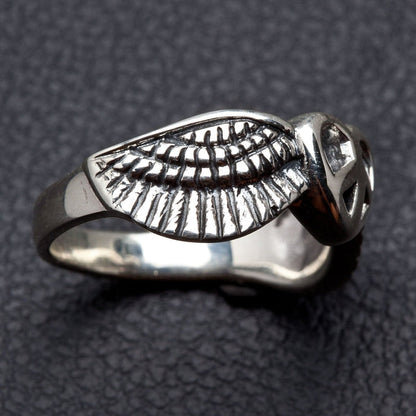 A bohemian-style peace ring, handcrafted from solid .925 sterling silver.