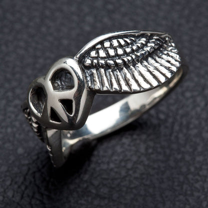 A handcrafted symbolic ring representing peace and love, with a solid sterling silver band.